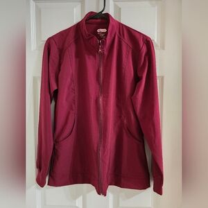 Woman's burgundy, scrub jacket.